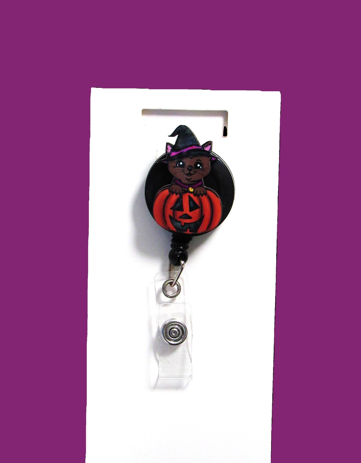 Witch Cat in a Pumpkin Shaped Sublimated Badge Reel