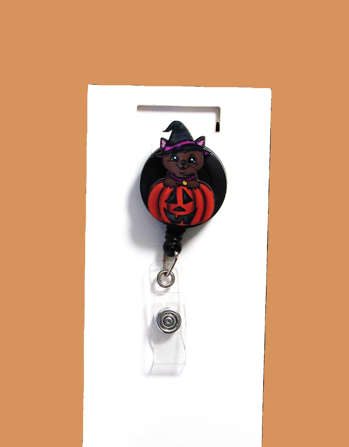 Witch Cat in a Pumpkin Shaped Sublimated Badge Reel