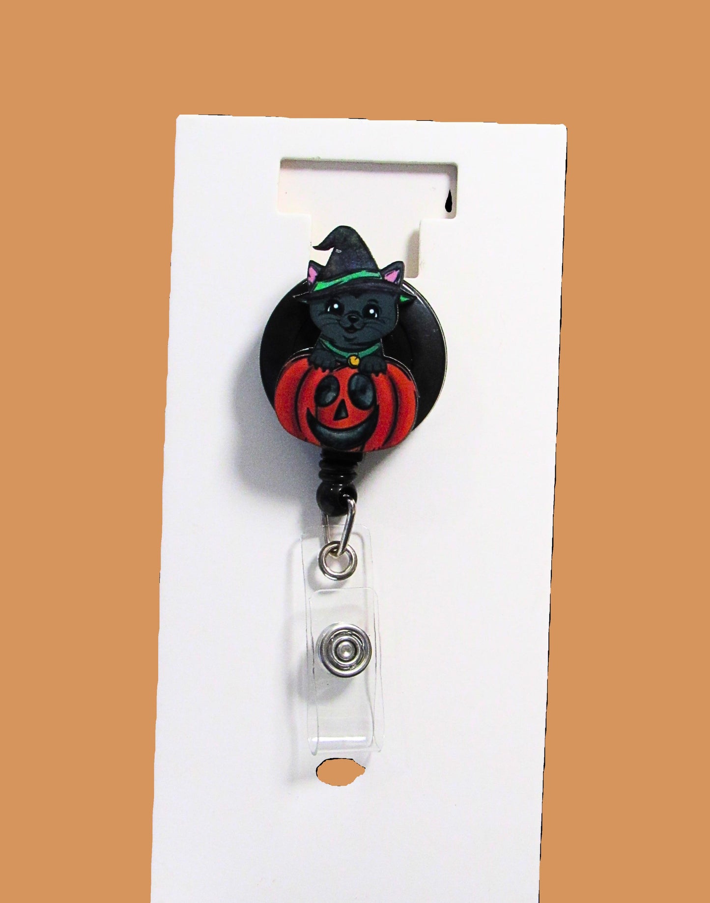 Witch Cat in a Pumpkin Shaped Sublimated Badge Reel