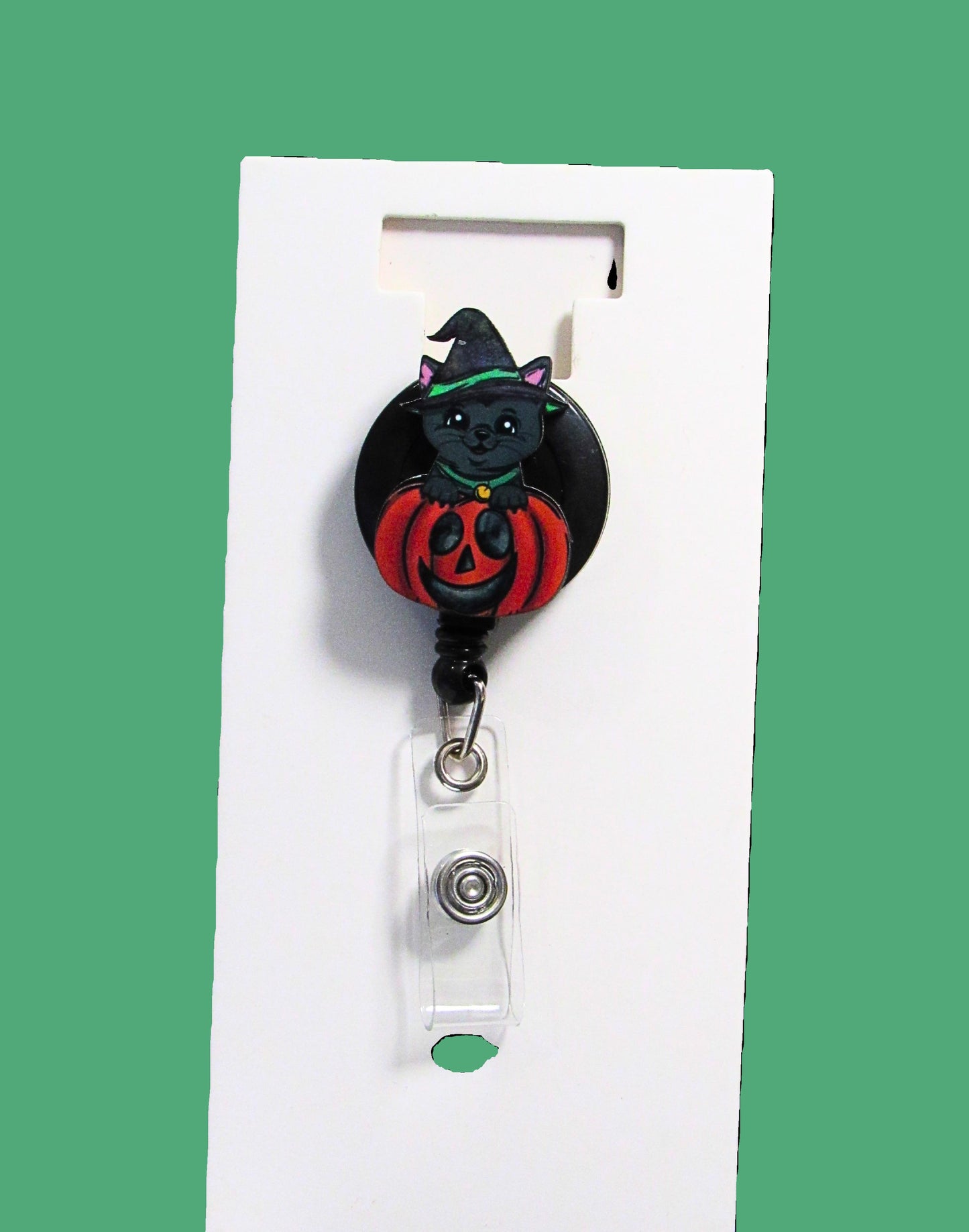 Witch Cat in a Pumpkin Shaped Sublimated Badge Reel